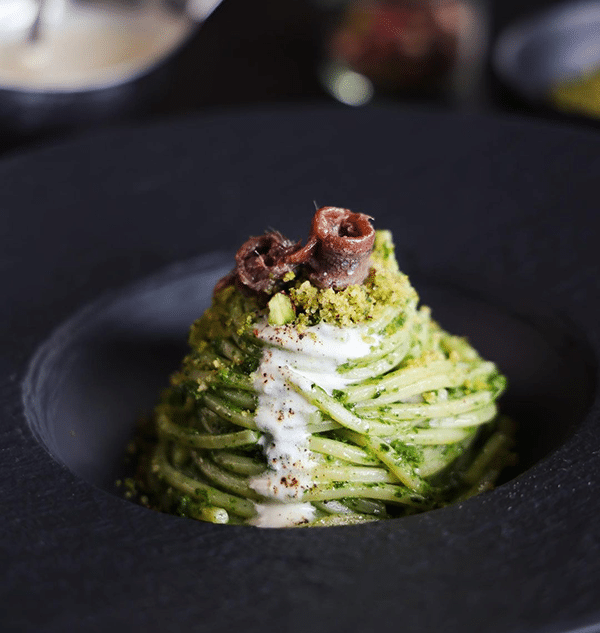Spaghetti with turnip greens pesto, Anchovies from the Cantabrian Sea and flavored panure | Rizzoli